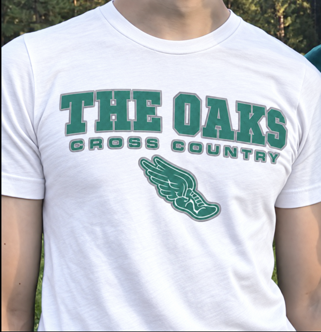 The new Oaks cross-country shirt — white shirt with green winged foot design